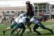 Oct 26, 2013; DeKalb, IL, USA; Northern Illinois Huskies quarterback Jordan Lynch (6) leaps into the end zone against Eastern Michigan Eagles defensive back Willie Creear (4) and linebacker Great Ibe (10) during the first half at Huskie Stadium. Mandatory
