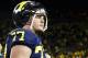 Nov 9, 2013; Ann Arbor, MI, USA; Michigan Wolverines offensive linesman Taylor Lewan (77) walks off the field after the game against the Nebraska Cornhuskers at Michigan Stadium. Nebraska won 17-13. Mandatory Credit: Rick Osentoski-USA TODAY Sports