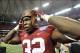 Aug 31, 2013; Atlanta, GA, USA; Alabama Crimson Tide linebacker C.J. Mosley (32) tries on the trophy after defeating Virginia Tech Hokies in the 2013 Chick-fil-A Kickoff game at the Georgia Dome. Alabama won 35-10. Mandatory Credit: Paul Abell-USA TODAY