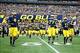 Nov 9, 2013; Ann Arbor, MI, USA; Michigan Wolverines offensive linesman Taylor Lewan (77) leads the team onto the field before the game against the Nebraska Cornhuskers at Michigan Stadium. Mandatory Credit: Rick Osentoski-USA TODAY Sports