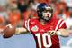 DALLAS - JANUARY 2: Quarterback Eli Manning #10 of the Mississippi Rebels looks for a receiver against the Oklahoma State Cowboys in the first quarter during the SBC Cotton Bowl January 2, 2004 at the Cotton Bowl in Dallas, Texas. Ole Miss won 31-28. (