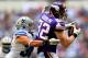 ARLINGTON, TX - NOVEMBER 03: Tight end Kyle Rudolph #82 of the Minnesota Vikings makes a catch as defensive back Jeff Heath #38 of the Dallas Cowboys defends during the game at Cowboys Stadium on November 3, 2013 in Arlington, Texas. (Photo by Jamie Squ