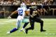 NEW ORLEANS, LA - NOVEMBER 10: Orlando Scandrick #32 of the Dallas Cowboys pursues Pierre Thomas #23 of the New Orleans Saints during a game at the Mercedes-Benz Superdome on November 10, 2013 in New Orleans, Louisiana. New Orleans won the game 49-17.