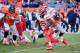 DENVER, CO - DECEMBER 30: Jamaal Charles #25 of the Kansas City Chiefs runs the ball against Justin Bannan #97 and Malik Jackson #70 of the Denver Broncos during the game at Sports Authority Field at Mile High on December 30, 2012 in Denver, Colorado. (