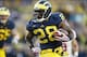 Oct 19, 2013; Ann Arbor, MI, USA; Michigan Wolverines running back Fitzgerald Toussaint (28) running the ball in for a touchdown in the third quarter against the Indiana Hoosiers at Michigan Stadium. Mandatory Credit: Rick Osentoski-USA TODAY Sports