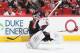 RALEIGH, NC - OCTOBER 13: Anton Khudobin#31 of the Carolina Hurricanes comes out of the crease to play the puck, loses his balance and leaves the game due to a lower body injury during an NHL game against the Phoenix Coyotes at PNC Arena on October 13, 20