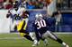 FOXBORO, MA - NOVEMBER 03: LeVeon Bell #26 of the Pittsburgh Steelers runs with the ball by Duron Harmon #30 of the New England Patriots in the first quarter at Gillette Stadium on November 3, 2013 in Foxboro, Massachusetts. (Photo by Jared Wickerham/Ge