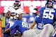 Oct 21, 2013; East Rutherford, NJ, USA; New York Giants defensive end Justin Tuck (91) tackles Minnesota Vikings running back Adrian Peterson (28) behind the line of scrimmage during the first half at MetLife Stadium. Mandatory Credit: Joe Camporeale-USA