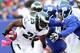 Jacquian Williams goes to tackle LeSean McCoy of the Eagles.