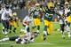 Nov 4, 2013; Green Bay, WI, USA; Green Bay Packers running back Eddie Lacy (27) breaks a tackle by Chicago Bears safety Chris Conte (47) for a 57-yard run in the 3rd quarter at Lambeau Field. Mandatory Credit: Benny Sieu-USA TODAY Sports