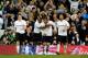 LONDON, ENGLAND - MARCH 27: Ryan Nelsen (2nd R) of Spurs is congratulated by Jermain Defoe (2nd L) after scoring the opening goal as teammates Luka Modric (L) and Benoit Assou-Ekotto (R) look on during the FA Cup sixth round match between Tottenham Hotsp