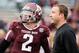 COLLEGE STATION, TX - NOVEMBER 09: Johnny Manziel #2 of the Texas A&M Aggies chats with his quarterback coach Jake Spavital before the game against the Mississippi State Bulldogs at Kyle Field on November 9, 2013 in College Station, Texas. (Photo by Sco