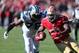 Nov 10, 2013; San Francisco, CA, USA; San Francisco 49ers running back Frank Gore (21) carries the ball ahead of Carolina Panthers defensive end Greg Hardy (76) during the second quarter at Candlestick Park. Mandatory Credit: Kelley L Cox-USA TODAY Sports