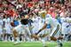 LINCOLN, NE - SEPTEMBER 14: Quarterback Taylor Martinez #3 of the Nebraska Cornhuskers runs past linebacker Aaron Wallace #51 of the UCLA Bruins during their game at Memorial Stadium on September 14, 2013 in Lincoln, Nebraska. (Photo by Eric Francis/Getty