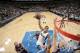 Monta Ellis attempts a dunk against Los Angeles Lakers center Chris Kaman