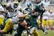 EAST LANSING, MI - NOVEMBER 02: Jeremy Langford #33 of the Michigan State Spartans battles for extra yards during a third quarter run while playing the Michigan Wolverines at Spartan Stadium on November 2, 2013 in East Lansing, Michigan. Michigan State wo