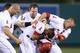 ANAHEIM, CA - JULY 04: (L-R) Albert Pujols #5, Josh Hamilton #32, Erick Aybar #2 and Mike Trout #27 of the Los Angeles Angels of Anaheim celebrate Aybar's walk off single against the St. Louis Cardinals in the ninth inning at Angel Stadium of Anaheim on
