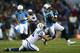 NASHVILLE, TN - NOVEMBER 14: Delanie Walker #82 of the Tennessee Titans tries to break the tackle of Pat Angerer #51 of the Indianapolis Colts in the first quarter at LP Field on November 14, 2013 in Nashville, Tennessee. (Photo by Andy Lyons/Getty Im