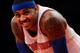 NEW YORK, NY - NOVEMBER 14: Carmelo Anthony #7 of the New York Knicks looks on during the second half against the Houston Rockets at Madison Square Garden on November 14, 2013 in New York City. The Rockets defeat the Knicks 109-106. NOTE TO USER: User exp