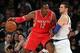 Nov 14, 2013; New York, NY, USA; Houston Rockets power forward Dwight Howard (12) controls the ball against New York Knicks power forward Andrea Bargnani (77) during the third quarter of a game at Madison Square Garden. The Rockets beat the Knicks 109-106