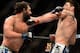 Mar 16, 2013; Montreal, Quebec, CAN; Johny Hendricks (blue) lands a punch on Carlos Condit (red) during their main card bout at UFC 158 at the Bell Centre. Mandatory Credit: Eric Bolte-USA TODAY Sports