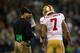 SEATTLE - SEPTEMBER 15: Head Coach Jim Harbaugh of the San Francisco 49ers talks with quarterback Colin Kaepernick #7 against the Seattle Seahawks on September 15, 2013 at Century Link Field in Seattle, Washington. (Photo by Jonathan Ferrey/Getty Images