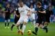 MADRID, SPAIN - NOVEMBER 09: Karim Benzema of Real Madrid CF competes for the ball with Inigo Martinez of Real Sociedad during the La Liga match between Real Madrid CF and Real Sociedad de Futbol at Estadio Santiago Bernabeu on November 9, 2013 in Madrid