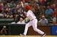 ARLINGTON, TX - SEPTEMBER 26: Jurickson Profar #13 of the Texas Rangers hits a walkoff homerun against the Los Angeles Angels at Rangers Ballpark in Arlington on September 26, 2013 in Arlington, Texas. (Photo by Ronald Martinez/Getty Images)