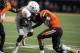 Sept 29, 2012; Stillwater, OK, USA; Texas Longhorns running back Malcolm Brown (28) runs the ball while being defended by Oklahoma State Cowboys cornerback Miketavius Jones (24) during the second half at Boone Pickens Stadium. Mandatory Credit: Mark D. S