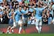 MANCHESTER, ENGLAND - AUGUST 31: Alvaro Negredo (L) of Manchester City celebrates with team-mates Jesus Navas and Pablo Zabaleta after scoring the opening goal of the Barclays Premier League match between Manchester City and Hull City at the Etihad Stadiu