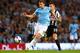 MANCHESTER, ENGLAND - AUGUST 19: Edin Dzeko of Manchester City beats Mathieu Debuchy of Newcastle United during the Barclays Premier League match between Manchester City and Newcastle United at the Etihad Stadium on August 19, 2013 in Manchester, England