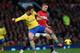 MANCHESTER, ENGLAND - NOVEMBER 10: Olivier Giroud of Arsenal battles with Nemanja Vidic of Manchester United during the Barclays Premier League match between Manchester United and Arsenal at Old Trafford on November 10, 2013 in Manchester, England. (Pho