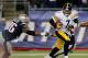 FOXBORO, MA - NOVEMBER 3: Ben Roethlisberger #7 of the Pittsburgh Steelers is chased by Andre Carter #96 of the New England Patriots in the 2nd half against the New England Patriots at Gillette Stadium on November 3, 2013 in Foxboro, Massachusetts. (Phot
