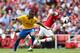 LONDON, ENGLAND - SEPTEMBER 15: Aaron Ramsey of Arsenal and Nathaniel Clyne of Southhampton fight for the ball during the Barclays Premier League match between Arsenal and Southampton at Emirates Stadium on September 15, 2012 in London, England. (Photo