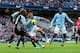 MANCHESTER, ENGLAND - NOVEMBER 11: William Gallas of Tottenham Hotspur tangles in the penalty box with Sergio Aguero of Manchester City during the Barclays Premier League match between Manchester City and Tottenham Hotspur at the Etihad Stadium on Novembe