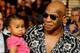 LAS VEGAS - JULY 31: Mike Tyson holds his daughter Milan as he arrives at the Juan Manuel Marquez and Juan Diaz bout at the Mandalay Bay Events Center July 31, 2010 in Las Vegas, Nevada. (Photo by Ethan Miller/Getty Images)