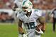 TAMPA, FL - NOVEMBER 11: Wide receiver Rishard Matthews #18 of the Miami Dolphins runs for a touchdown against the Tampa Bay Buccaneers November 11, 2013 at Raymond James Stadium in Tampa, Florida. Tampa won 22 - 19. (Photo by Al Messerschmidt/Getty Ima