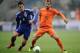 GENK, BELGIUM - NOVEMBER 16: Rafael van der Vaart of Netherlands is challenged by Shinji Okazaki of Japan during the International Friendly match between the Netherlands and Japan on November 16, 2013 in Genk, Belgium. (Photo by Dennis Grombkowski/Getty