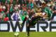 MEXICO CITY, MEXICO - NOVEMBER 13: Paul Aguilar of Mexico struggles for the ball with Andrew Durante of New Zealand during a match between Mexico and New Zealand as part of the FIFA World Cup Qualifiers at Azteca Stadium on November 13, 2013 in Mexico Cit