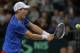 BELGRADE, SERBIA - NOVEMBER 15: Tomas Berdych of Czech Republic plays a backhand against Dusan Lajovic of Serbia during the day one of the final Davis Cup match between Serbia and Czech Republic on November 15, 2013 in Belgrade, Serbia. (Photo by Srdjan S