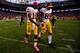 DENVER, CO - OCTOBER 27: Quarterback Robert Griffin III #10 of the Washington Redskins consoles wide receiver Leonard Hankerson #85 as the walk off the field after losing to the Denver Broncos 45-21 at Sports Authority Field Field at Mile High on October