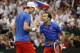 BELGRADE, SERBIA - NOVEMBER 16: Radek Stepanek (R) of Czech Republic speaks to team-mate Tomas Berdych during their men's doubles match on day two of the Davis Cup World Group Final between Serbia and Czech Republic at Kombank Arena on November 16, 2013 i
