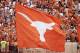 AUSTIN, TX - SEPTEMBER 5: A fan waves a large Lonhorns flag during the game between the Louisiana Monroe Warhawks and the Texas Longhorns on September 5, 2009 at Darrell K Royal-Texas Memorial Stadium in Austin, Texas. The Longhorns defeated the Warhawks
