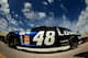 HOMESTEAD, FL - NOVEMBER 16: Jimmie Johnson drives the #48 Lowe's/Kobalt Tools Chevrolet through the garage area during practice for the NASCAR Sprint Cup Series Ford EcoBoost 400 at Homestead-Miami Speedway on November 16, 2013 in Homestead, Florida. (