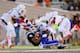 DURHAM, NC - NOVEMBER 16: (L-R) Tyrone Cornelius #31, Al Highsmith #30 and Deon Bush #2 of the Miami Hurricanes tackle Josh Snead #9 of the Duke Blue Devils during play at Wallace Wade Stadium on November 16, 2013 in Durham, North Carolina. (Photo by Gr