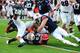 AUBURN, AL - NOVEMBER 16: Todd Gurley #3 of the Georgia Bulldogs is tackled by Anthony Swain #43, Craig Sanders #13, and Jonathon Mincy #6 of the Auburn Tigers at Jordan-Hare Stadium on November 16, 2013 in Auburn Alabama. (Photo by Scott Cunningham/Getty