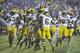 Nov 16, 2013; Evanston, IL, USA; The Michigan Wolverines celebrate their overtime win against the Northwestern Wildcats at Ryan Field. The Michigan Wolverines defeated the Northwestern Wildcats 27-19 in triple overtime. Mandatory Credit: David Banks-USA T