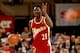 EAST RUTHERFORD, NJ - 1993: Dominique Wilkins #21 of the Atlanta Hawks signals a play as he moves the ball up court against the New Jersey Nets during a 1993 NBA game at the Brendan Byrne Arena in East Rutherford, New Jersey. NOTE TO USER: User expressl