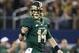 Nov 16, 2013; Arlington, TX, USA; Baylor Bears quarterback Bryce Petty (14) points to a teammate after a touchdown in the fourth quarter of the game against the Texas Tech Red Raiders at AT&T Stadium. Baylor beat Texas Tech 63-34. Mandatory Credit: Tim H