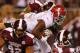 STARKVILLE, MS - NOVEMBER 16: T.J. Yeldon #4 of the Alabama Crimson Tide rushes against Kaleb Eulls #92 and Denico Autry #90 of the Mississippi State Bulldogs at Davis Wade Stadium on November 16, 2013 in Starkville, Mississippi. (Photo by Kevin C. Cox/